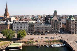 an aerial view of a city with a river and buildings at Elite Hotel Savoy in Malmö