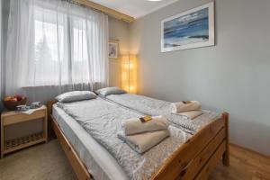 Posteľ alebo postele v izbe v ubytovaní Apartament Frajda Zakopane