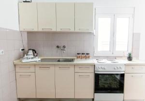 Kuchyň nebo kuchyňský kout v ubytování Castello Apartments