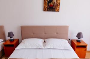 Postel nebo postele na pokoji v ubytování Castello Apartments