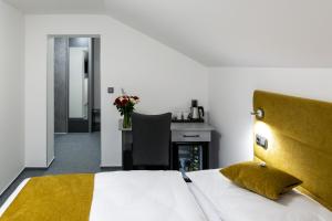Postel nebo postele na pokoji v ubytování Wellness Hotel Edelweiss