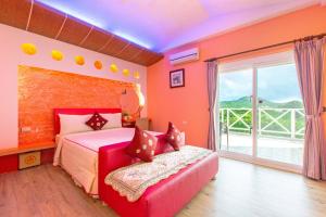 Rúm í herbergi á Ocean Star B&B
