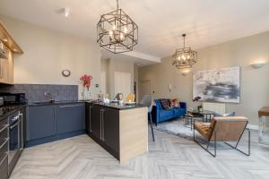 A kitchen or kitchenette at ALTIDO Luxury flats in Old Town, right on Royal Mile