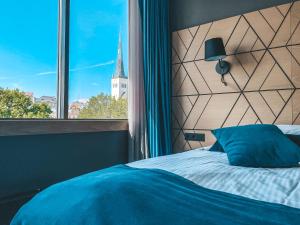 Postel nebo postele na pokoji v ubytování Kalev Spa Hotel & Waterpark