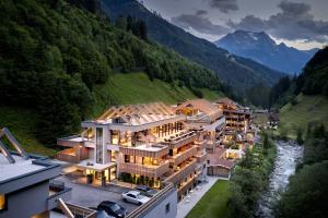 an aerial view of a house in the mountains at ZillergrundRock Luxury Mountain Resort in Mayrhofen