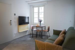 a living room with a couch and a table at HomeSanGil in Burgos