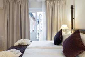 Postel nebo postele na pokoji v ubytování Elite Hotel Arcadia