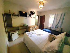 Postel nebo postele na pokoji v ubytování Villa Residencial Encantos Da Mata