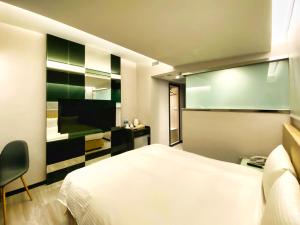 TV a/nebo společenská místnost v ubytování Hub Hotel Ximen Inn + 20 fotografií