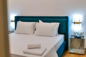 Postel nebo postele na pokoji v ubytování Chimaera Hotel