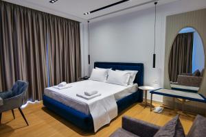 Postel nebo postele na pokoji v ubytování Chimaera Hotel + 37 fotografií
