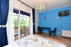 TV a/nebo společenská místnost v ubytování Green Gile Villa in Druskininkai Center