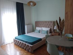 Ένα ή περισσότερα κρεβάτια σε δωμάτιο στο DREAM HOME