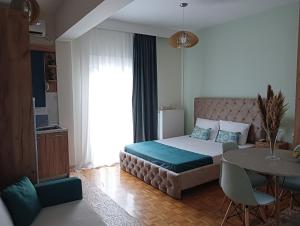 Ένα ή περισσότερα κρεβάτια σε δωμάτιο στο DREAM HOME