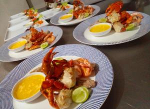 a group of plates of food on a table at Oruwa Boutique Villas in Arugam Bay