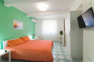 Llit o llits en una habitació de B&B Porta Della Sicilia