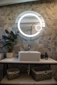 a bathroom with a sink and a mirror at Boboli Holiday House Acharavi Corfu in Acharavi +18 photos