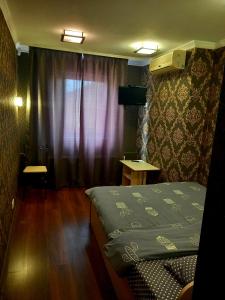 Postel nebo postele na pokoji v ubytování Rodina Hotel