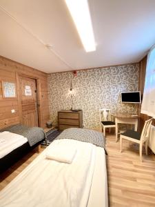 Postel nebo postele na pokoji v ubytování Lumi Guest House