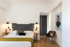 Postel nebo postele na pokoji v ubytování Hotel Plaza Opéra