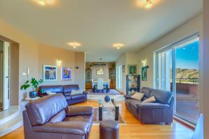 a living room with leather couches and a table at Villa Desideria in Solin