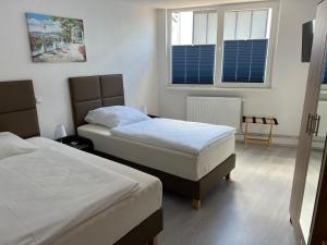 Postel nebo postele na pokoji v ubytování Ferienwohnungen Schewe I