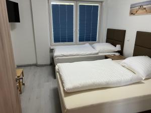 Postel nebo postele na pokoji v ubytování Ferienwohnungen Schewe I