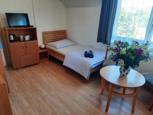 Postel nebo postele na pokoji v ubytování Penzion U Mnicha