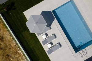 The swimming pool at or close to Exquisite Villas with Enchanting Surroundings, By ThinkVilla