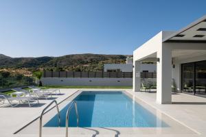 The swimming pool at or close to Exquisite Villas with Enchanting Surroundings, By ThinkVilla