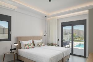 A bed or beds in a room at Exquisite Villas with Enchanting Surroundings, By ThinkVilla