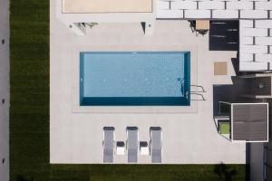 The swimming pool at or close to Exquisite Villas with Enchanting Surroundings, By ThinkVilla