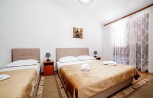 Voodi või voodid majutusasutuse Castello Apartments toas