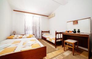 Postel nebo postele na pokoji v ubytování Castello Apartments