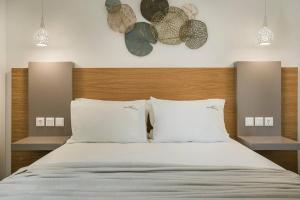 A bed or beds in a room at Villa Iokasti - Ionian Treasure Villas