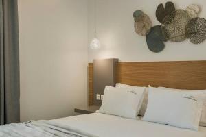 A bed or beds in a room at Villa Iokasti - Ionian Treasure Villas