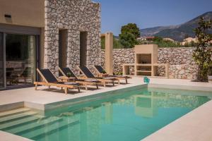 The swimming pool at or close to Villa Iokasti - Ionian Treasure Villas