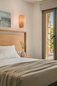A bed or beds in a room at Villa Iokasti - Ionian Treasure Villas