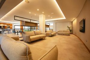 a living room with couches and chairs in a building at Vértice Indalo Almería in Almería