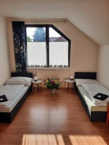 Postel nebo postele na pokoji v ubytování Penzion U Mnicha