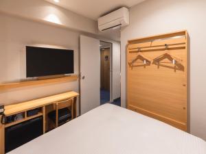 Rúm í herbergi á Sotetsu Fresa Inn Sendai
