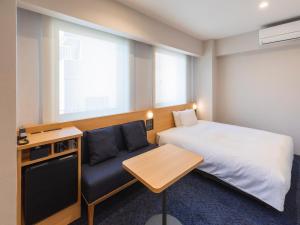 Rúm í herbergi á Sotetsu Fresa Inn Sendai