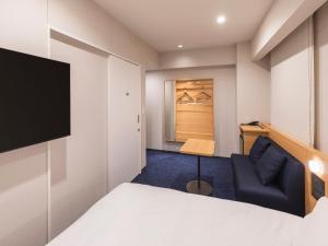 Sjónvarps- og/eða afþreyingartæki á Sotetsu Fresa Inn Sendai