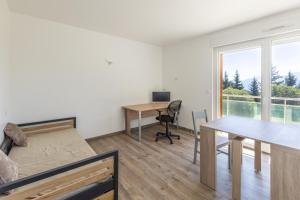a living room with a desk and a table at Panoramic Campus in Font-Romeu-Odeillo-Via