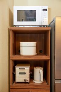 Cuina o zona de cuina de 古今 天下茶屋 with a private parking lot and a half open-air bath and direct to KIX