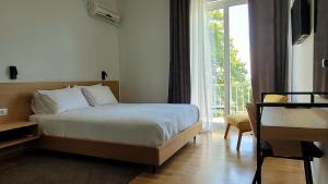 Postel nebo postele na pokoji v ubytování Theoxenia Hotel