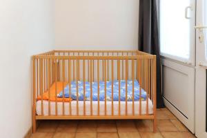 Postel nebo postele na pokoji v ubytování Friesenmeer Ferienwohnung Eins