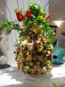 a vase filled with flowers and plants on a table at Cala Rosa Club Hotel in Stintino
