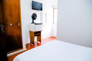 VOA Hotel Rezende客房内的一张或多张床位