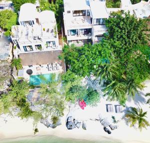 an aerial view of a resort on the beach at Lola by Coco B Isla in Isla Mujeres